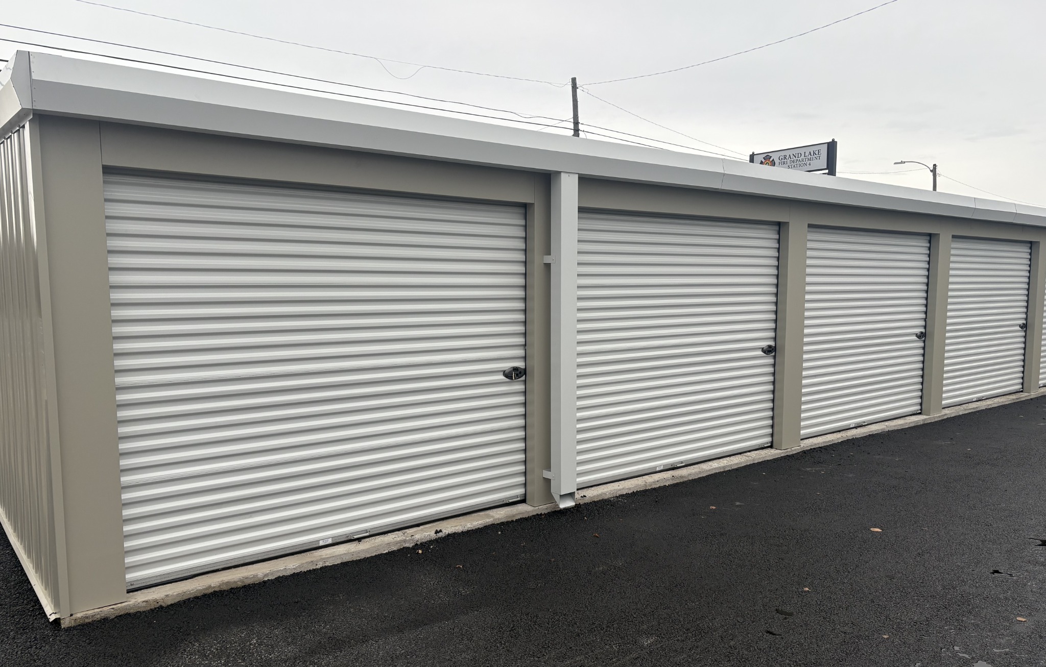 Row of roll-up storage unit doors at DOMTOR Storage